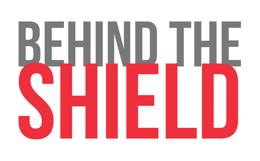 Behind The Shield Logo